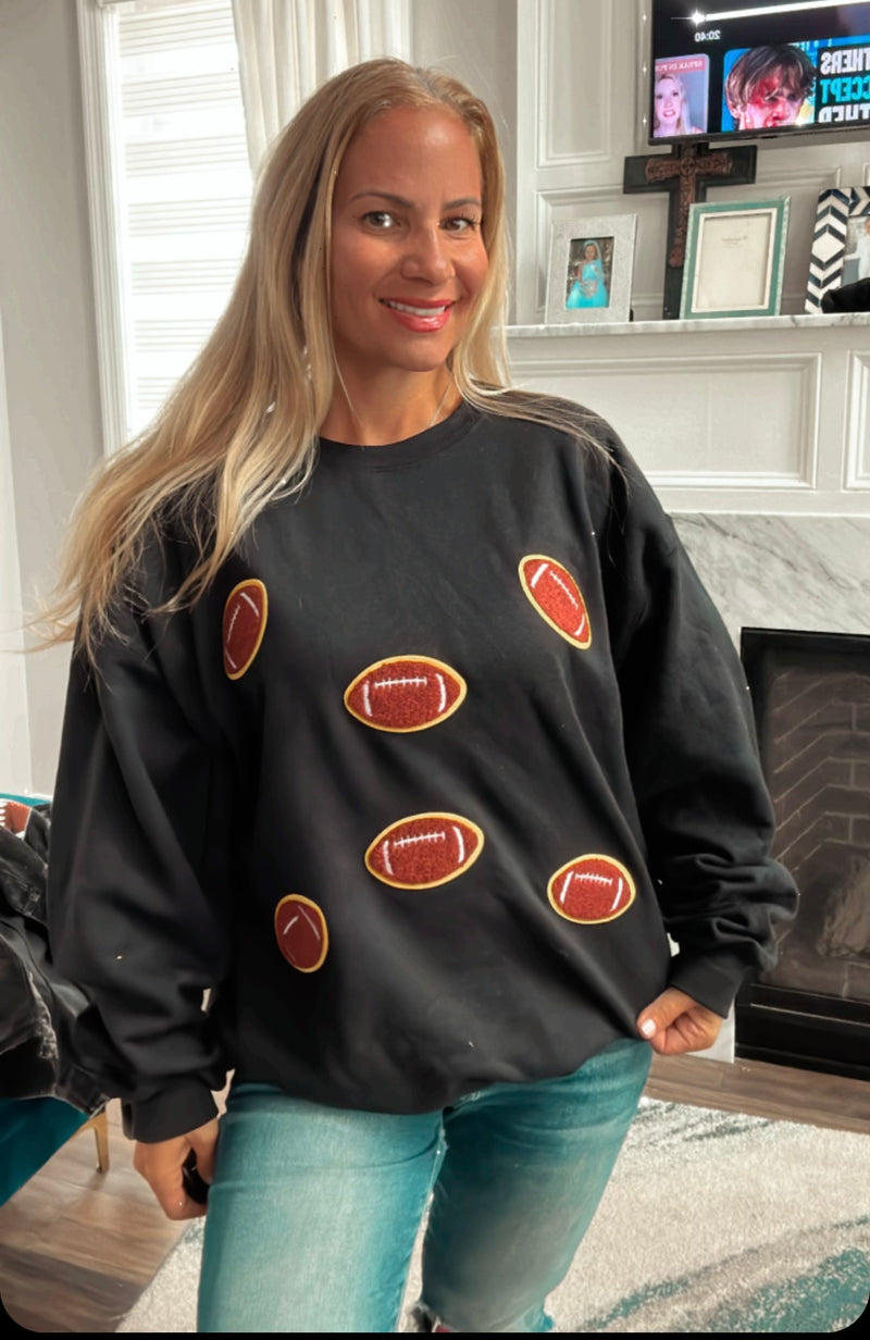 Sweatshirt with football patches